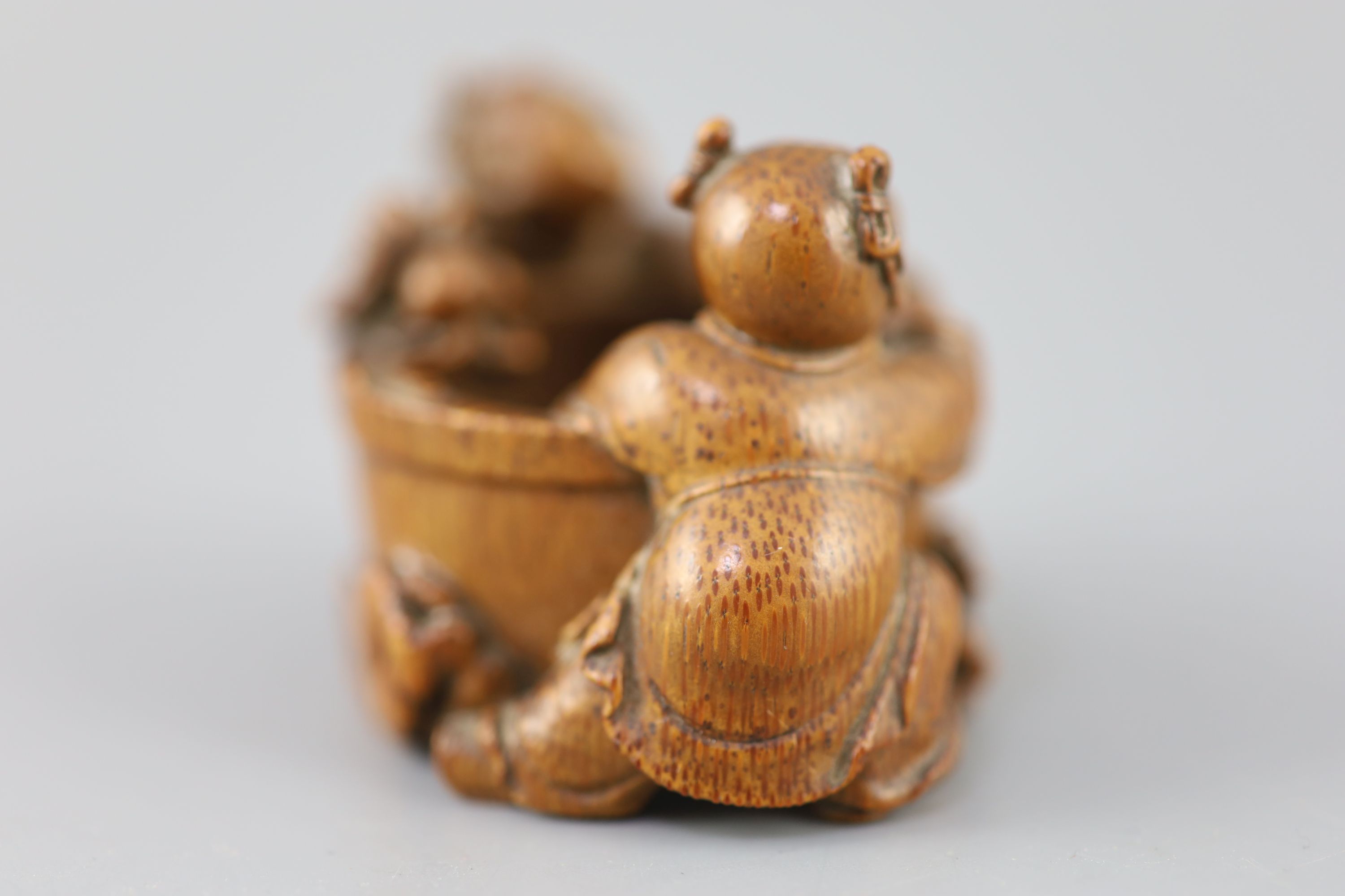 A fine and rare Chinese bamboo-root boys and fish bowl brush washer, 18th/19th century,